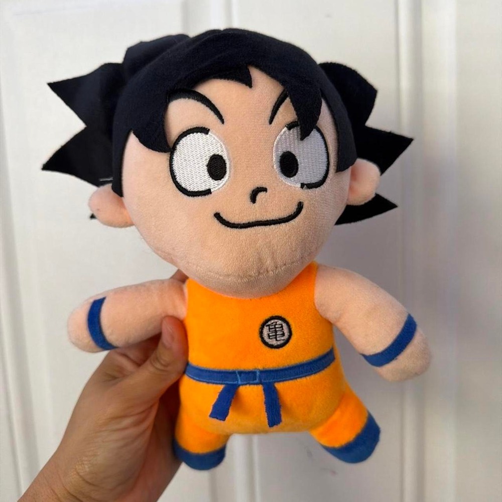 10in Goku plushie from Dragon Ball Z Orange with blue trim and a circular logo
